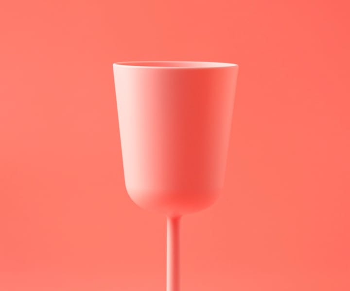 Pink cup in pink background.